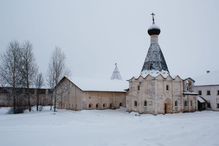 church and refectory covered with snow in Kirillo-Belozersky Monastery in Russia