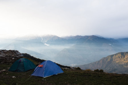 tents on the top of the mountain in himalayas