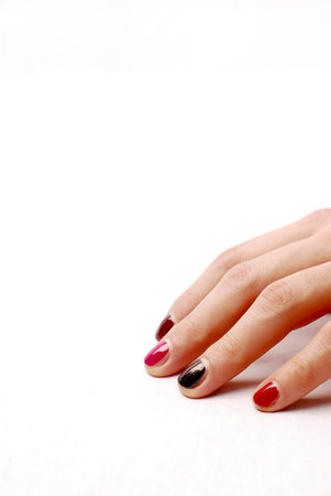 hand with coloured nails on white background