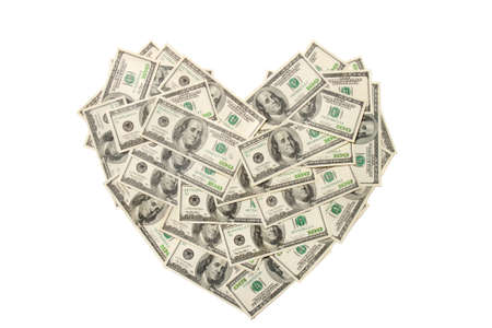 Heart made of hundred dollar banknotes isolated on white backgroundの写真素材
