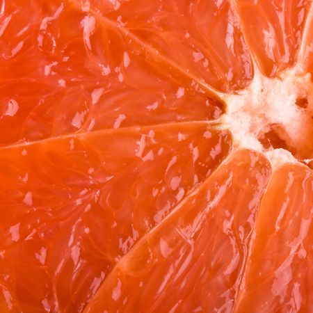 Ripe grapefruit slice close upの写真素材