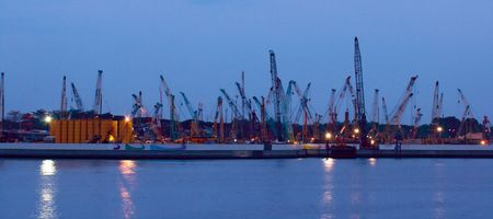 Harbor cranes in Singapore at dusk. Panoramic photoの写真素材