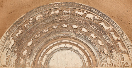 Ancient moonstone at the entrance of Buddhist dagoba (stupa). Anuradhapura, Sri Lanka