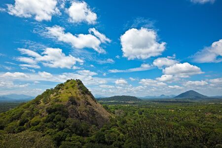 Sky above small mountains, covered with trees. Sri Lankaの写真素材