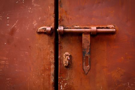 Old latch on the doorの写真素材