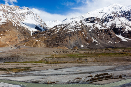 Spiti Valley - village and snowcapped Himalayan Mountains. Himachal Pradesh, Indiaの写真素材