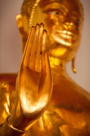 Buddha golden statue blessing handの写真素材