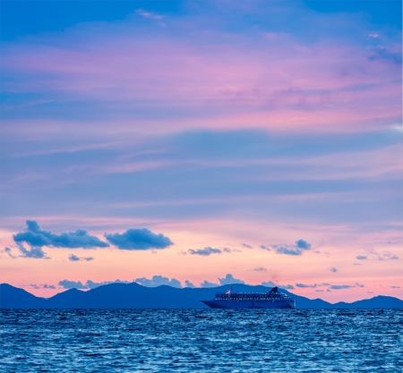 Vacation cruise background - sunset sea with cruise ship. Andaman sea, Thailandの写真素材