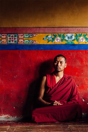 DISKIT, INDIA - SEPTEMBER 12, 2012: Unidentified Tibetan Buddhist monk in Diskit gompa on September 12, 2012 in Diskit, India. Diskit gompa is the oldest and largest Buddhist monastery (gompa) in the Nubra Valley of Ladakh, Indiaのeditorial素材
