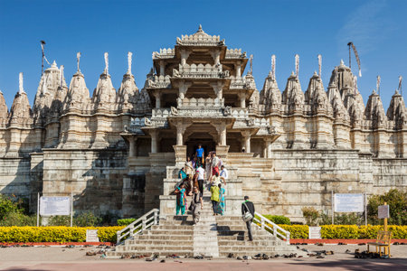 RANAKPUR, INDIA - NOVEMBER 25, 2012: Tourists and worshippers visit Jain temple in Ranakpur, Rajasthan, Indiaのeditorial素材