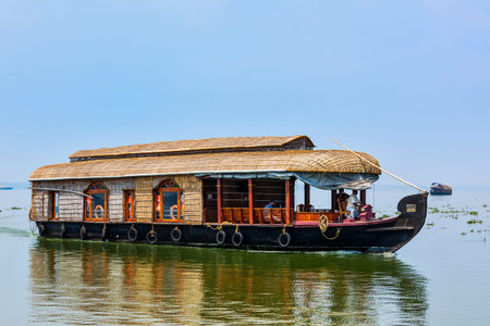 KERALA, INDIA - FEBRUARY 23, 2013: Houseboat on Kerala backwaters. Kerala backwaters are both major tourist attraction and integral part of local people life in Keralaのeditorial素材