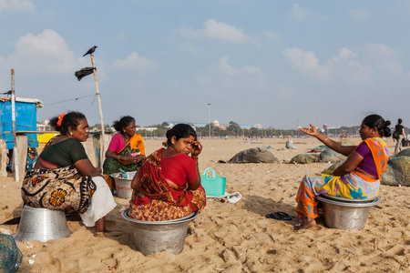 CHENNAI, INDIA - FEBRUARY 10, 2013: Local Indian women on Marina beach in Chennai. Marina beach is the world's second longest urban beach.のeditorial素材