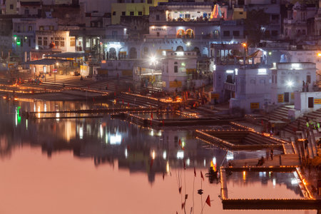 PUSHKAR, INDIA - NOVEMBER 21, 2012: Sacred Puskhar lake (Sagar) and ghats of  town Pushkar in twilight in the evening. Pushkar is one of the oldest existing cities of India and important pilgrimage site for Hindusのeditorial素材