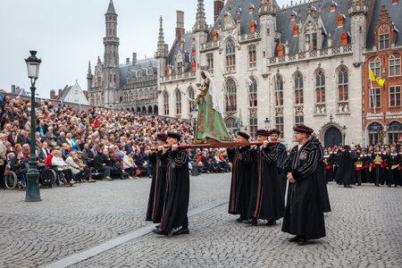 BRUGES, BELGIUM - MAY 17: Annual Procession of the Holy Blood on Ascension Day. Locals carry statue of the Virgin Mary. May 17, 2012 in Bruges (Brugge), Belgiumのeditorial素材