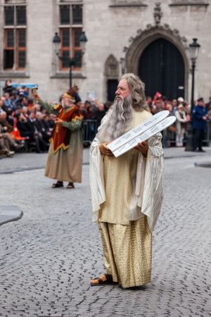 BRUGES, BELGIUM - MAY 17: Annual Procession of the Holy Blood on Ascension Day. Locals perform  dramatizations of Biblical events - Moses with the Ten Commandments. May 17, 2012 in Bruges (Brugge), Belgiumのeditorial素材