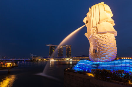 SINGAPORE - JANUARY 1, 2014: Night view of Singapore Merlion at Marina Bay and Marina Bay Sand complex. 
Merlion is a well-known tourist icon, mascot and national personification of Singaporeのeditorial素材