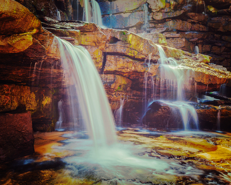 Vintage retro effect filtered hipster style image of tropical waterfall. Popokvil Waterfall, Bokor National Park, Cambodiaの写真素材