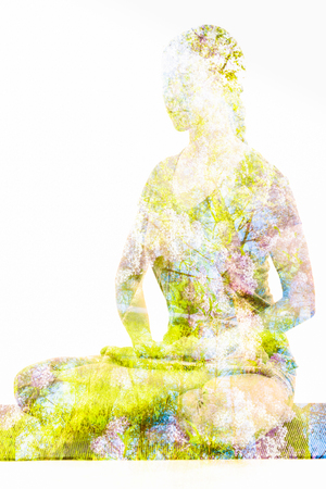 Double exposure image of  woman doing yoga asanaの写真素材