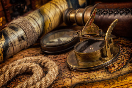 Travel geography navigation concept background - old vintage retro compass with sundial, spyglass...
