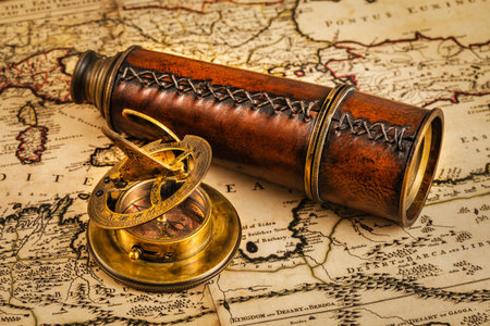 Travel geography navigation concept background - old vintage retro compass with sundial and spyglass...