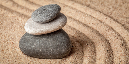 Japanese Zen stone garden - relaxation, meditation, simplicity and balance concept  - letterbox panorama of pebbles and raked sand tranquil calm sceneの写真素材