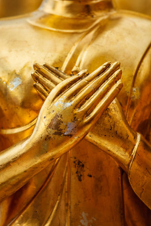 Gold Buddha statue hands close up in Wat Phra That Doi Suthep, Chiang Mai, Thailand