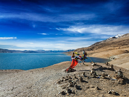 Buddhist prayer flags lungta at Himalayan lake Tso Moriri, Korzok, Ladakh, India