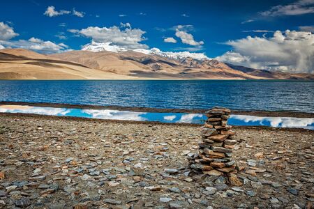Stone cairn at Himalayan lake Tso Moriri, Korzok,  Changthang area, Ladakh, Jammu and Kashmir, Indiaの写真素材