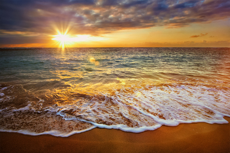 Beach holidays vacation background - calm ocean during tropical sunriseの写真素材