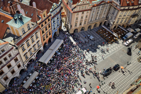 PRAUGE, CZECH REPUBLIC - APRIL 26, 2012: Tourist crowd watching Prague astronomical clock animated figures hourly motion on the Old Town Squareのeditorial素材