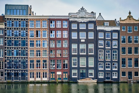 Amsterdam canal Damrak with houses, Netherlandsの写真素材