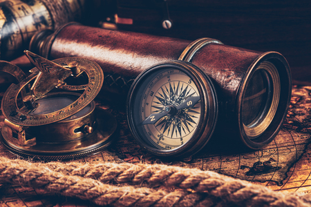 Old vintage compass on ancient mapの写真素材