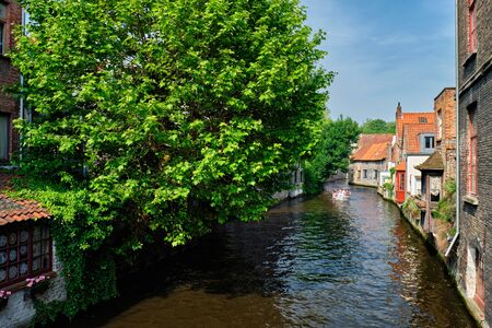 Tourist boat in canal. Brugge Bruges, Belgiumの写真素材