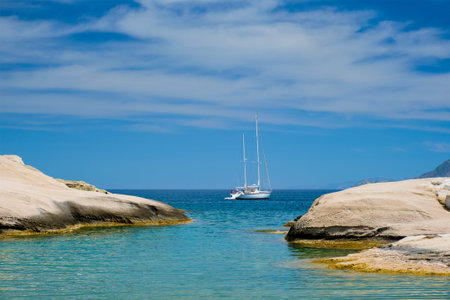 Greek holidays concept. Beautiful romantic island Milos. Yacht boat at Sarakiniko Beach, Milos...