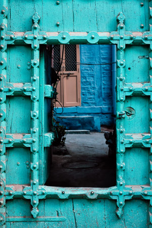 Old door in blue houses of Jodhpur, Rajasthan, Indiaの写真素材