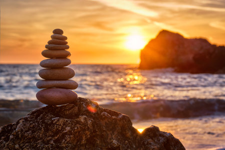 Concept of balance and harmony - stone stack on the beach