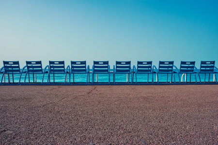 Famous blue chairs on beach of Nice, Franceの写真素材
