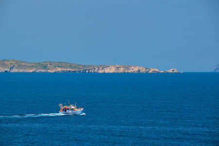 Greek fishing boat in Aegean sea near Milos island, Greeceの写真素材