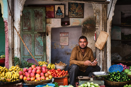 Pushkar, India - November 7, 2019: Vegetable fruit street shop vendor selling vegetables and fruits...