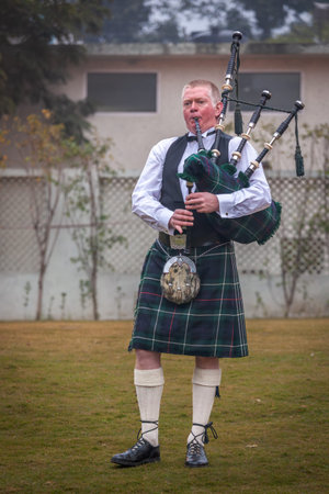 New Delhi, India - January 10, 2010: Scottish piper from Scotland in traditional outfit with tartan...