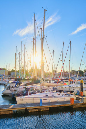 Lisbon marina on Tagus river with moored yachts and boats on sunset. Belem, Lisbon, Portugal
