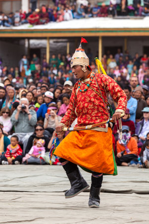 LEH, INDIA - SEPTEMBER 08, 2012: Dancers in traditional Ladakhi Tibetan costumes perform warlike dance at the Annual Festival of Ladakh Heritage in Leh, India. September 08, 2012のeditorial素材