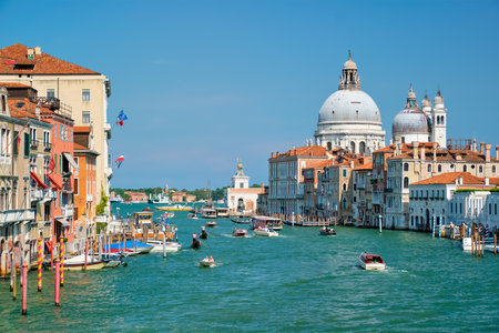 VENICE, ITALY - JULY 19, 2019: View of Venice Grand Canal with boats and Santa Maria della Salute church in the day from Ponte dellAccademia bridge. Venice, Italyのeditorial素材