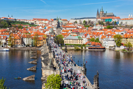 PRAGUE, CZECH REPUBLIC - APRIL 26, 2012: Charles Bridge over Vltava river crowded with tourists in Prague, Czech republicのeditorial素材