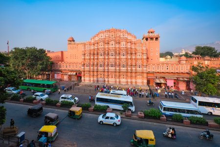 Jaipur, India - November 2, 2019: Famous landmark Hawa Mahal Palace of winds with people, road traffic and city transport. Mughal cultural heritage famous tourist attraction. Jaipur, Rajasthan, Indiaのeditorial素材