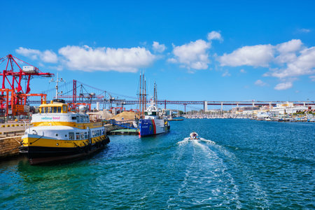 Lisbon, Portugal - September 6, 2022: Port of Lisbon with moored tourist Yellow Boat boat and Patrol Vessel BOJADOR and speedboat on sunny day. Tagus river, Lisbon, Portugalのeditorial素材