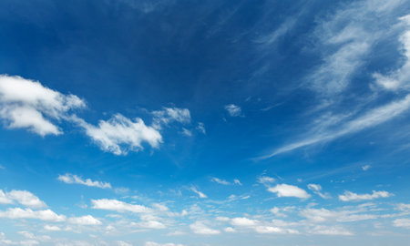 Clear Blue Sky with Whispy White Clouds - Perfect for Nature and Weather Backgroundsの写真素材