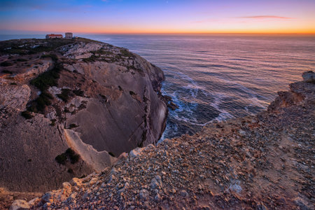 Cabo Espichel cape Espichel on Atlantic ocean at sunset with ruinsの写真素材