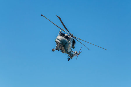 Military helicopter in blue sky