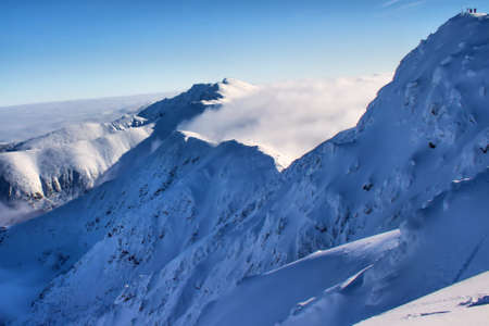 Mountains rise above the cloudsの写真素材